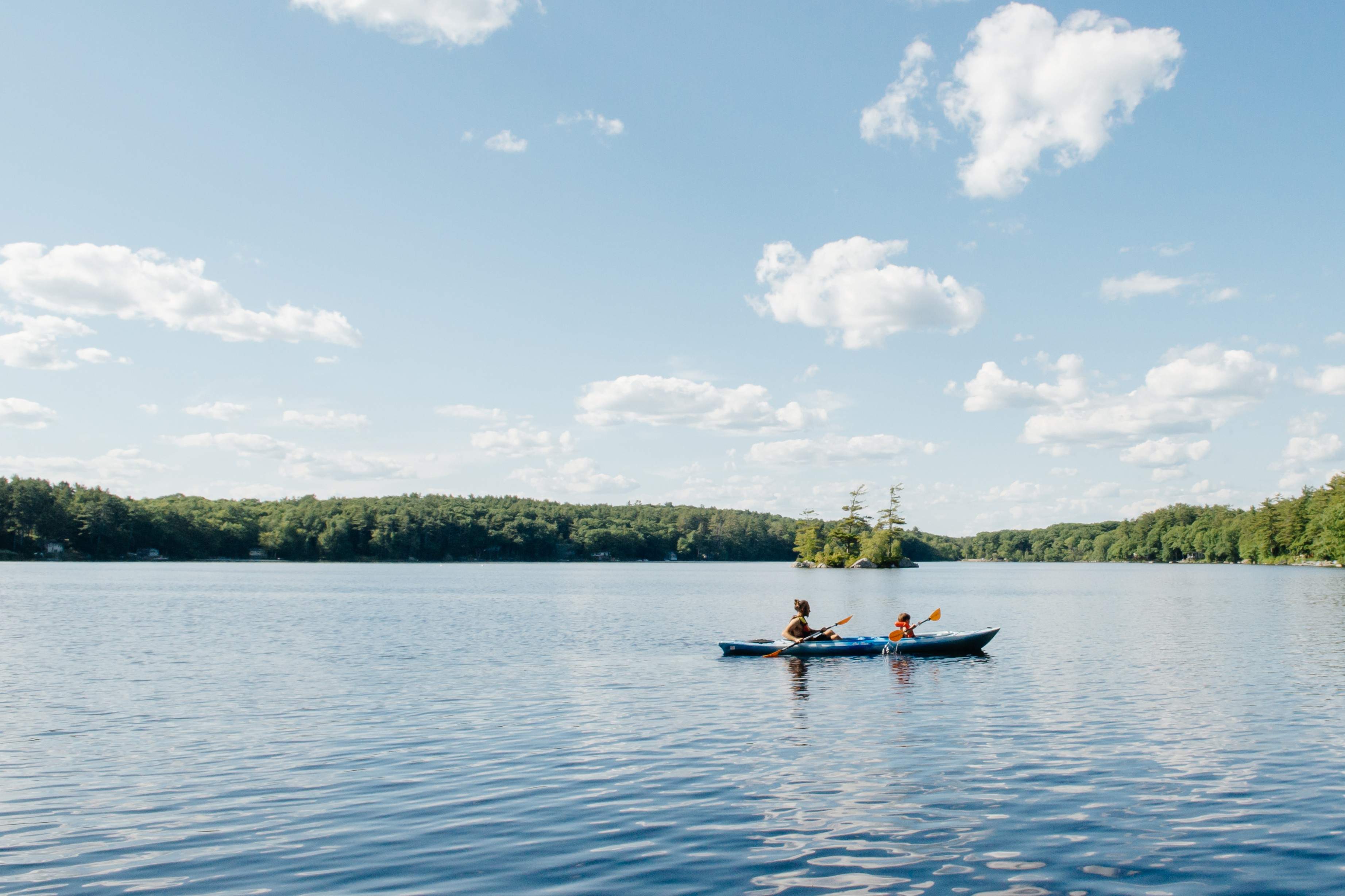 People Kayaking on Lake