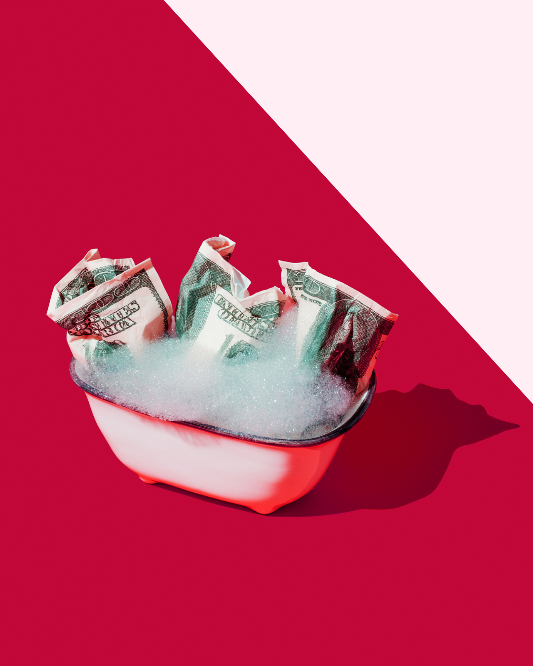 Toy bathtub with money and suds inside